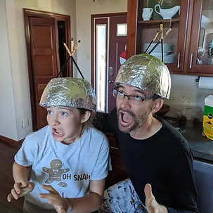 Daman and a child with foil hats